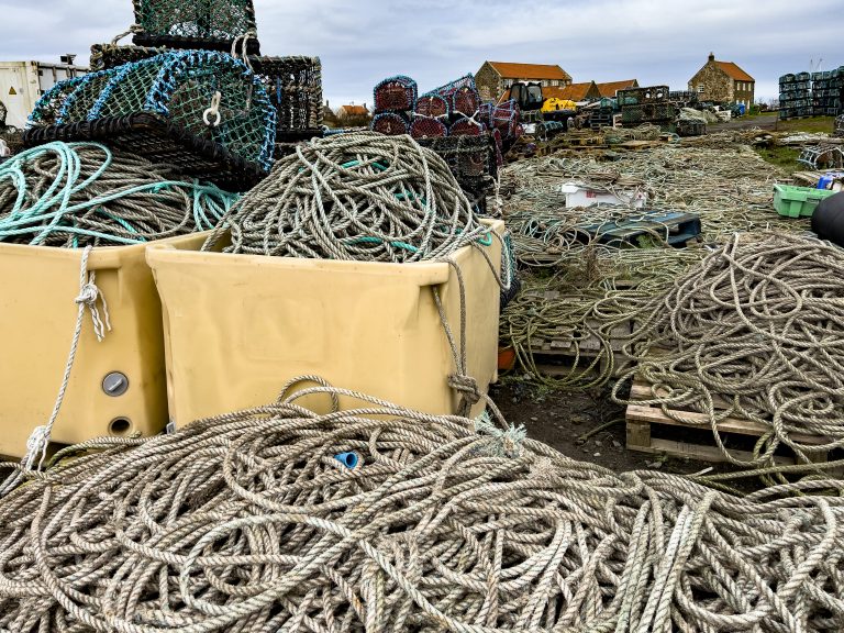 Fishing rope and pots on the side of the harbour